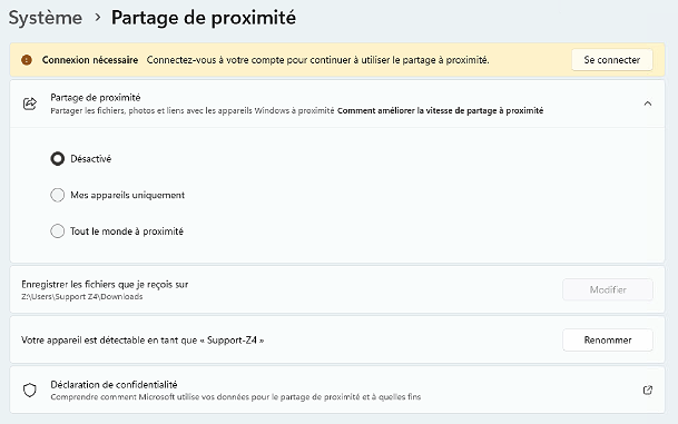 Fenêtre Paramètres de Windows 11 en français, section Système > Partage de proximité, avec un bandeau indiquant « Connexion nécessaire », l’option Partage de proximité réglée sur « Désactivé », les choix « Mes appareils uniquement » et « Tout le monde à proximité », ainsi que les réglages du dossier d’enregistrement, du nom de l’appareil détectable « Support-Z4 » et un lien vers la déclaration de confidentialité.