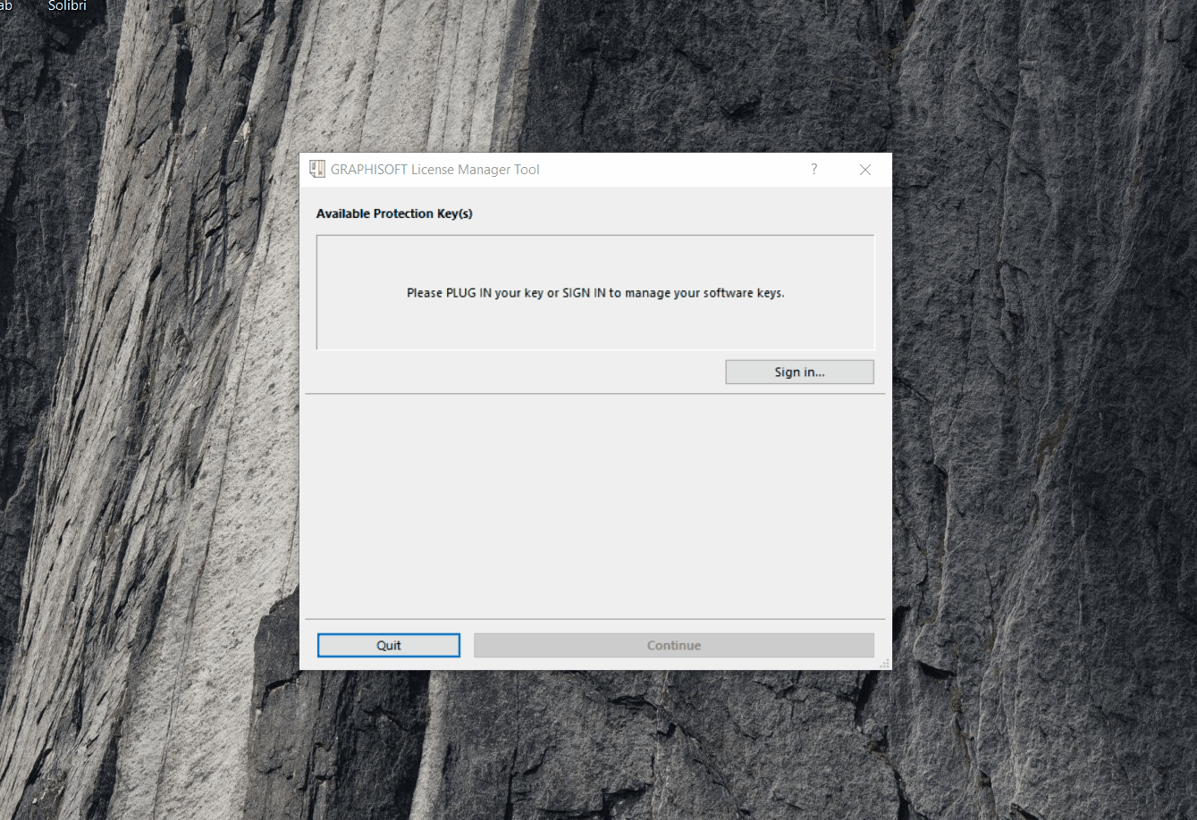 Janela do GRAPHISOFT License Manager Tool com título "Available Protection Key(s)", mensagem "Please PLUG IN your key or SIGN IN to manage your software keys.", botão "Sign in..." à direita e botões "Quit" (destacado) e "Continue" na parte inferior.